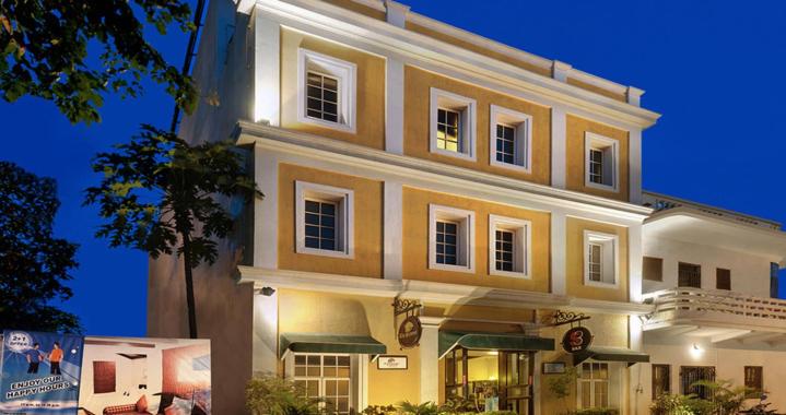 a large building is lit up at night at The Richmond in Puducherry