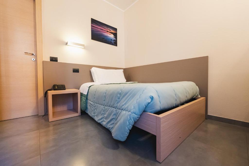 Postel nebo postele na pokoji v ubytování Parini Hotel