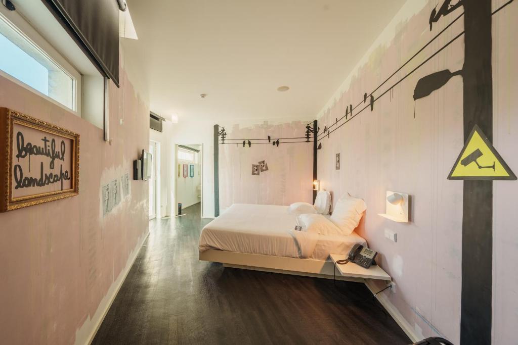 Postel nebo postele na pokoji v ubytování Design & Wine Hotel