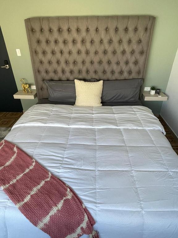 Postel nebo postele na pokoji v ubytování La Buena Vida Inn