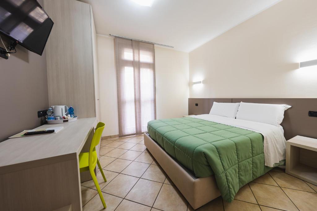 Postel nebo postele na pokoji v ubytování Parini Hotel