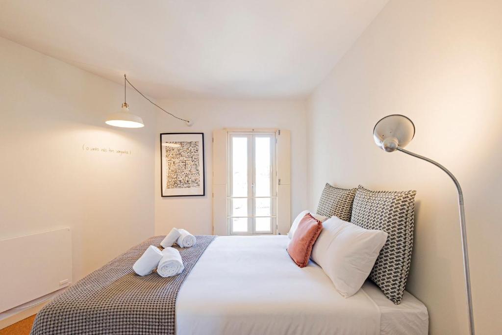 Postel nebo postele na pokoji v ubytování Casa 128 by LovelyStay
