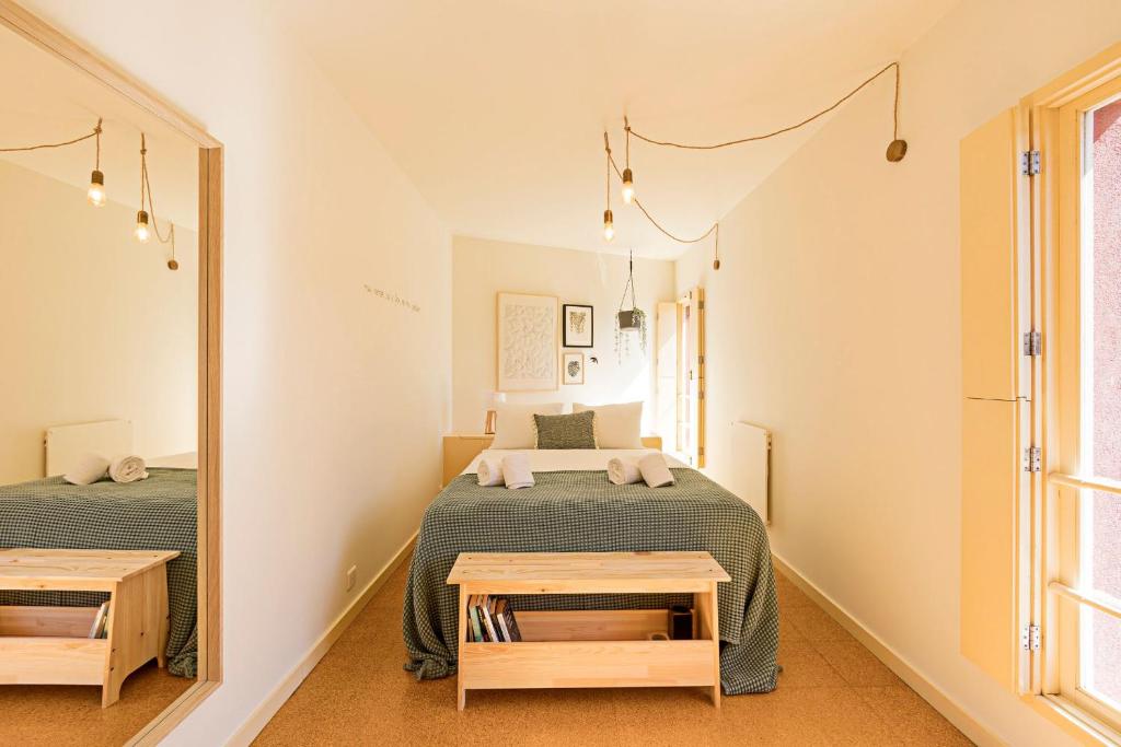 Postel nebo postele na pokoji v ubytování Casa 128 by LovelyStay