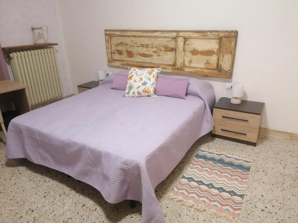 Łóżko lub łóżka w pokoju w obiekcie Agriturismo Poggio alla Luna