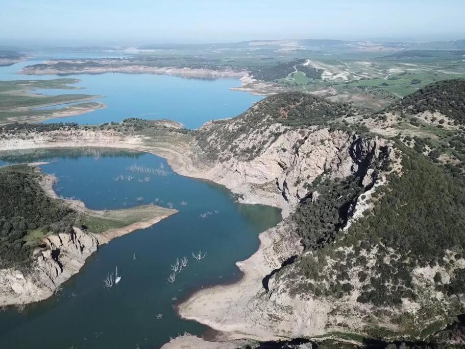 an aerial view of a large body of water at Casa Rural Dehesa de Algar in Algar