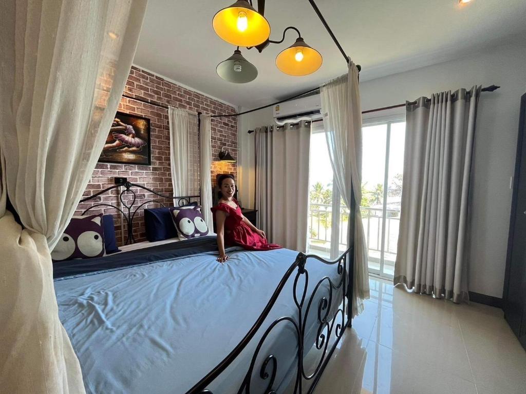 Postel nebo postele na pokoji v ubytování Mooz Huahin Bed & Breakfast
