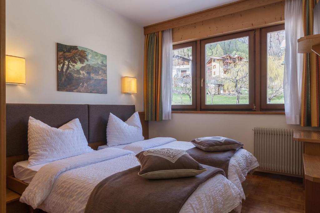 Postel nebo postele na pokoji v ubytování Hotel Arcobaleno
