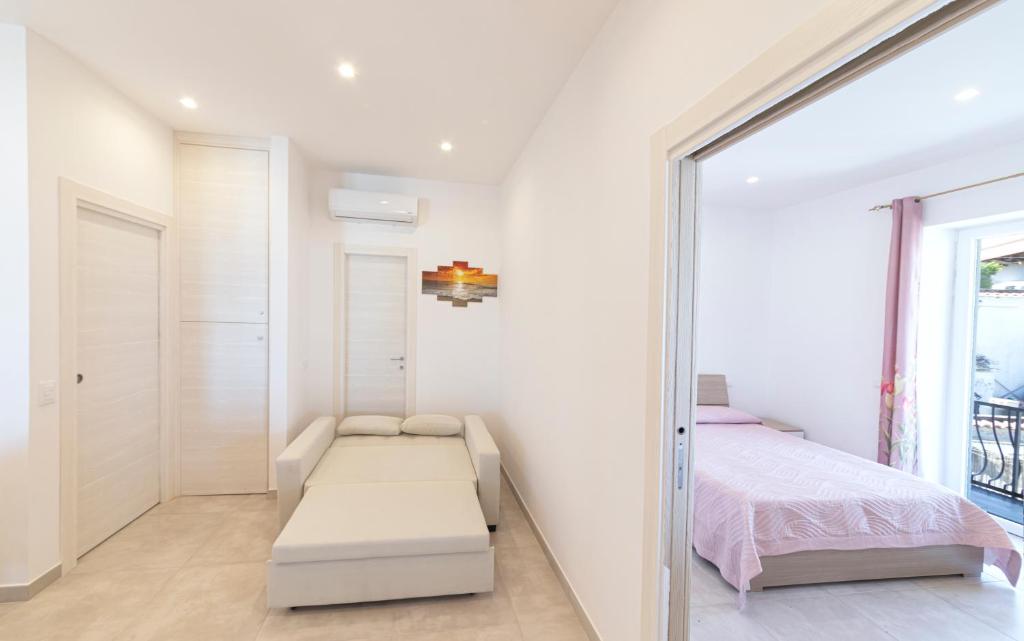 Ένα ή περισσότερα κρεβάτια σε δωμάτιο στο Casa degli Aranci