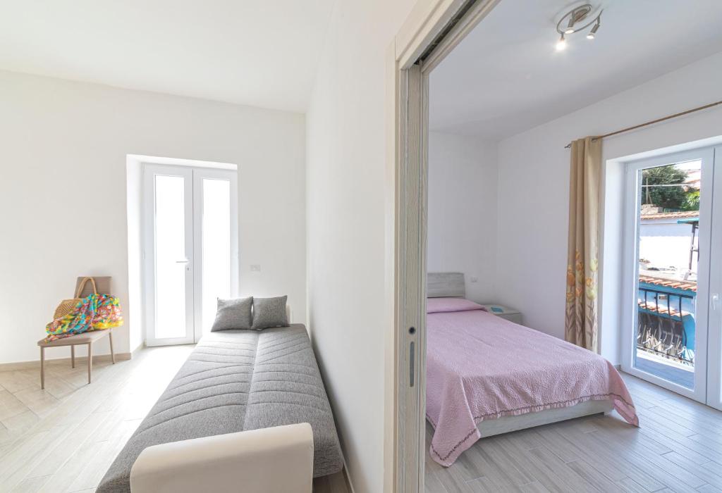 Ένα ή περισσότερα κρεβάτια σε δωμάτιο στο Casa degli Aranci