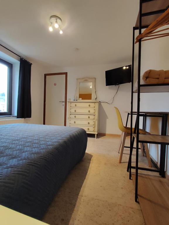 Postel nebo postele na pokoji v ubytování Au Rocher