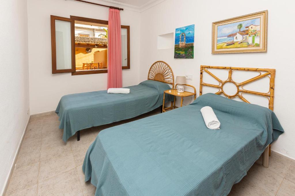 Posteľ alebo postele v izbe v ubytovaní Villa moli de ca n'orell