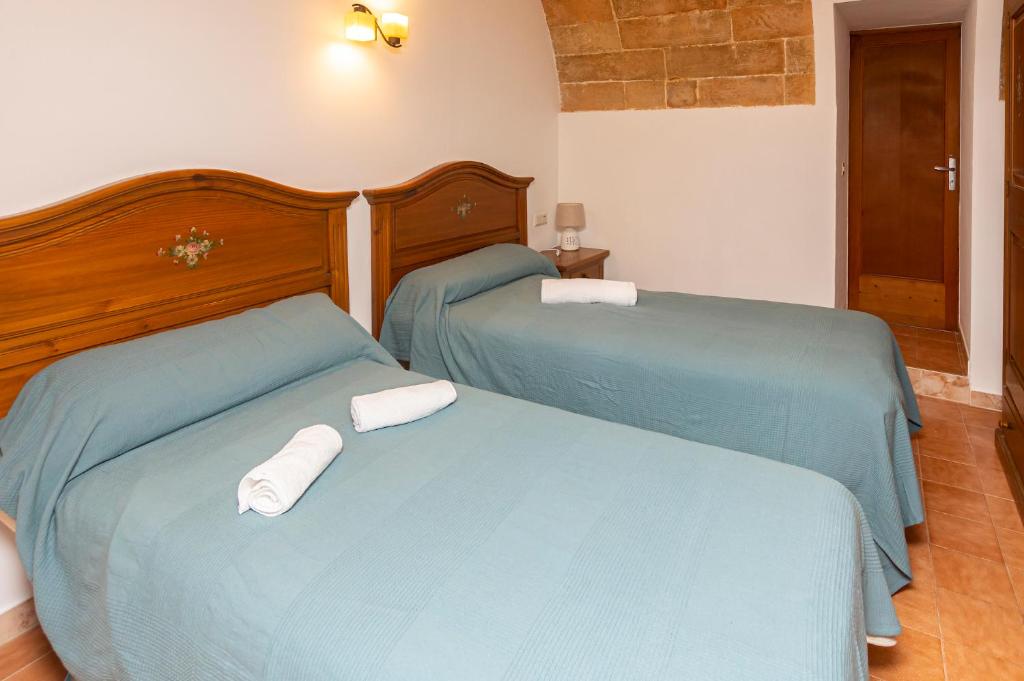 Posteľ alebo postele v izbe v ubytovaní Villa moli de ca n'orell