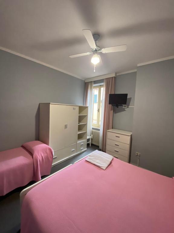 Postel nebo postele na pokoji v ubytování HOTEL LA LOGGIA
