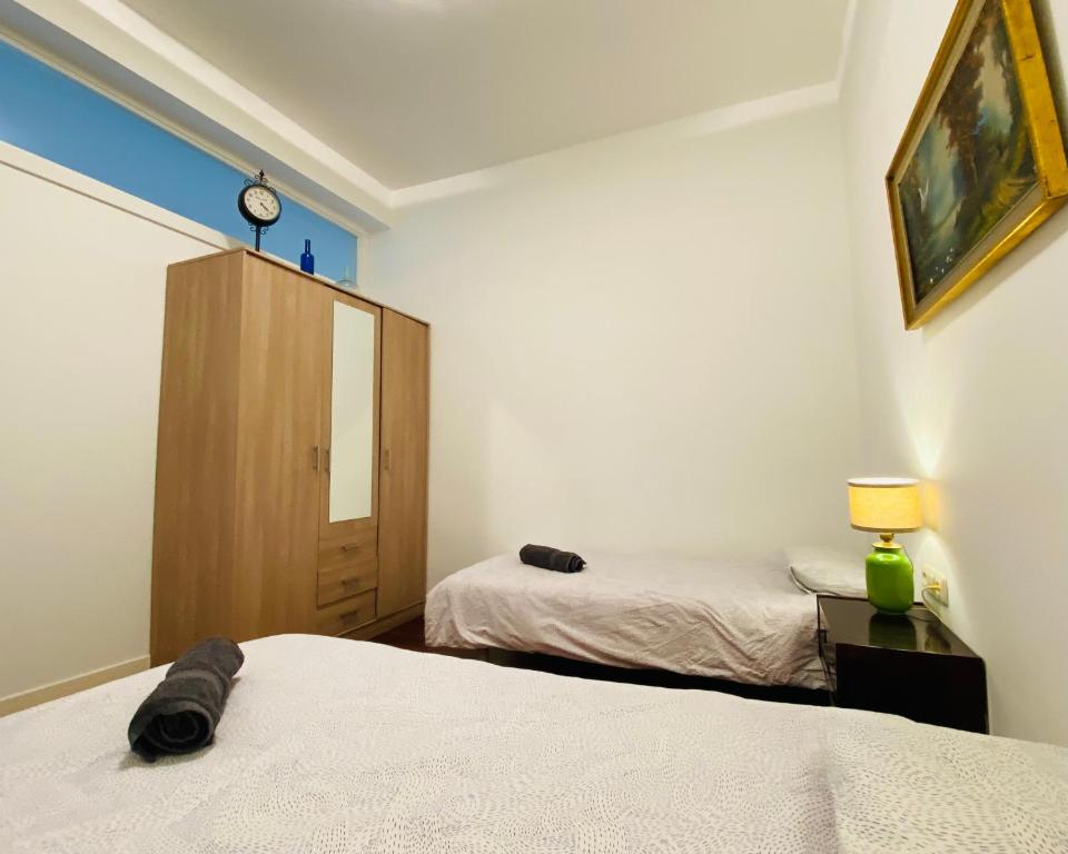 Posteľ alebo postele v izbe v ubytovaní La plaza apartment