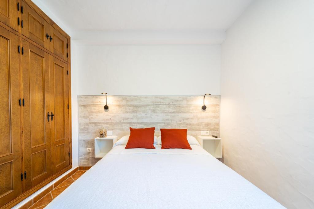 Łóżko lub łóżka w pokoju w obiekcie Apartamento Jibazahora B1
