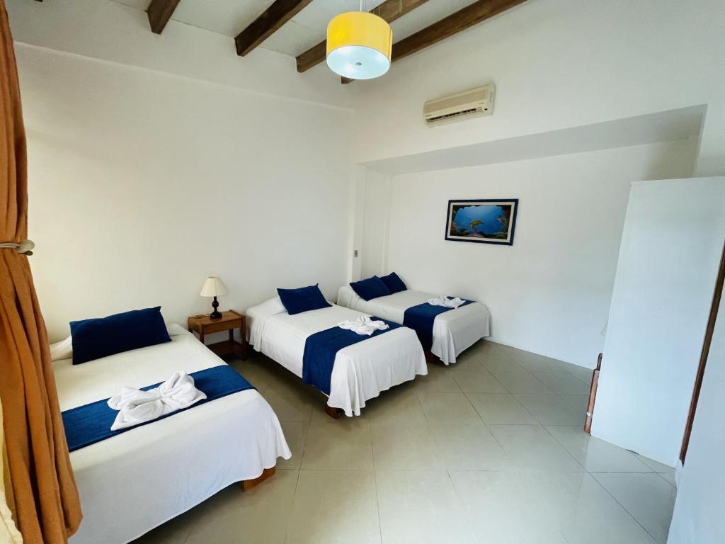 Postel nebo postele na pokoji v ubytování Fernandina Hotel & Spa