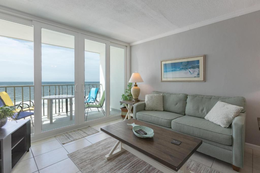 a living room with a couch and a view of the ocean at Island Shores 654 in Gulf Shores