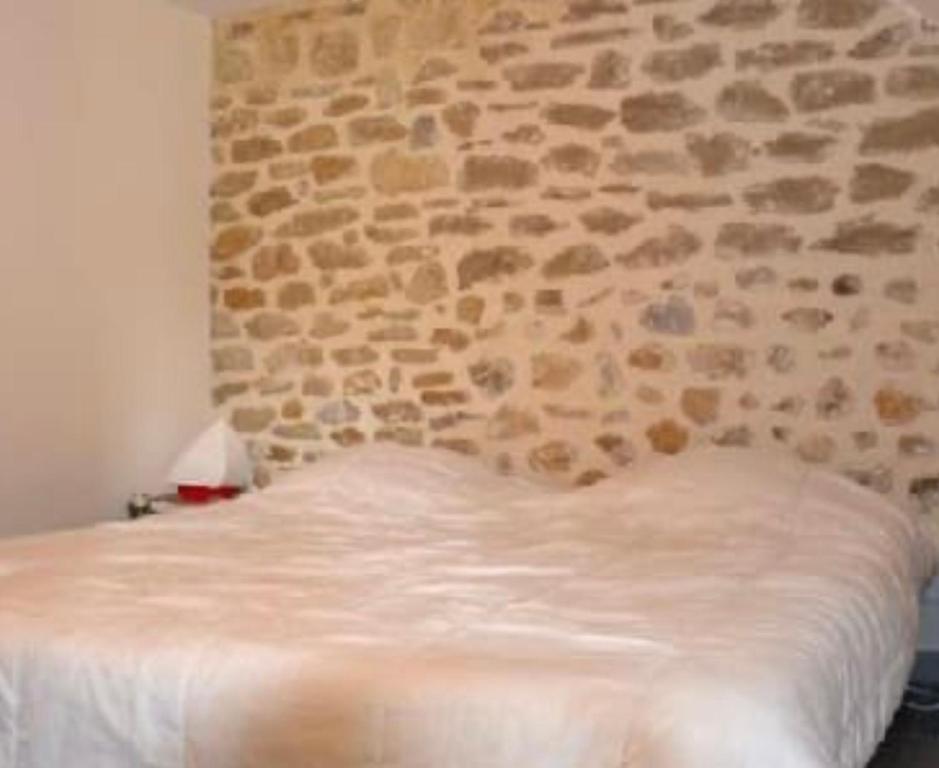 Postel nebo postele na pokoji v ubytování Gîte Les Oliviers
