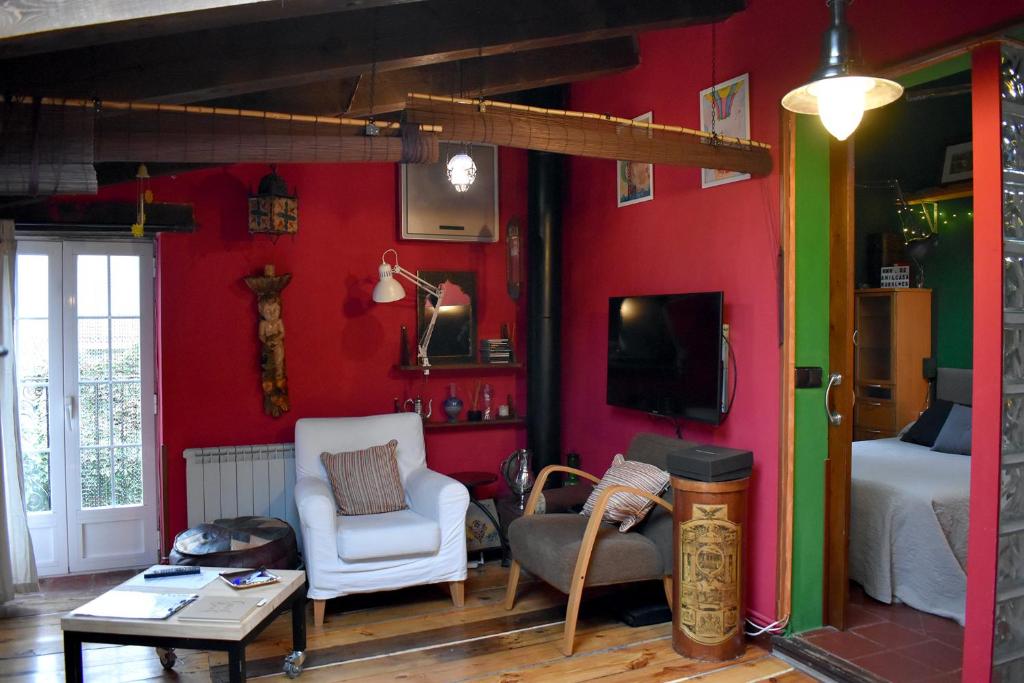 TV a/nebo společenská místnost v ubytování Casa rural De Añil - Jardín privado