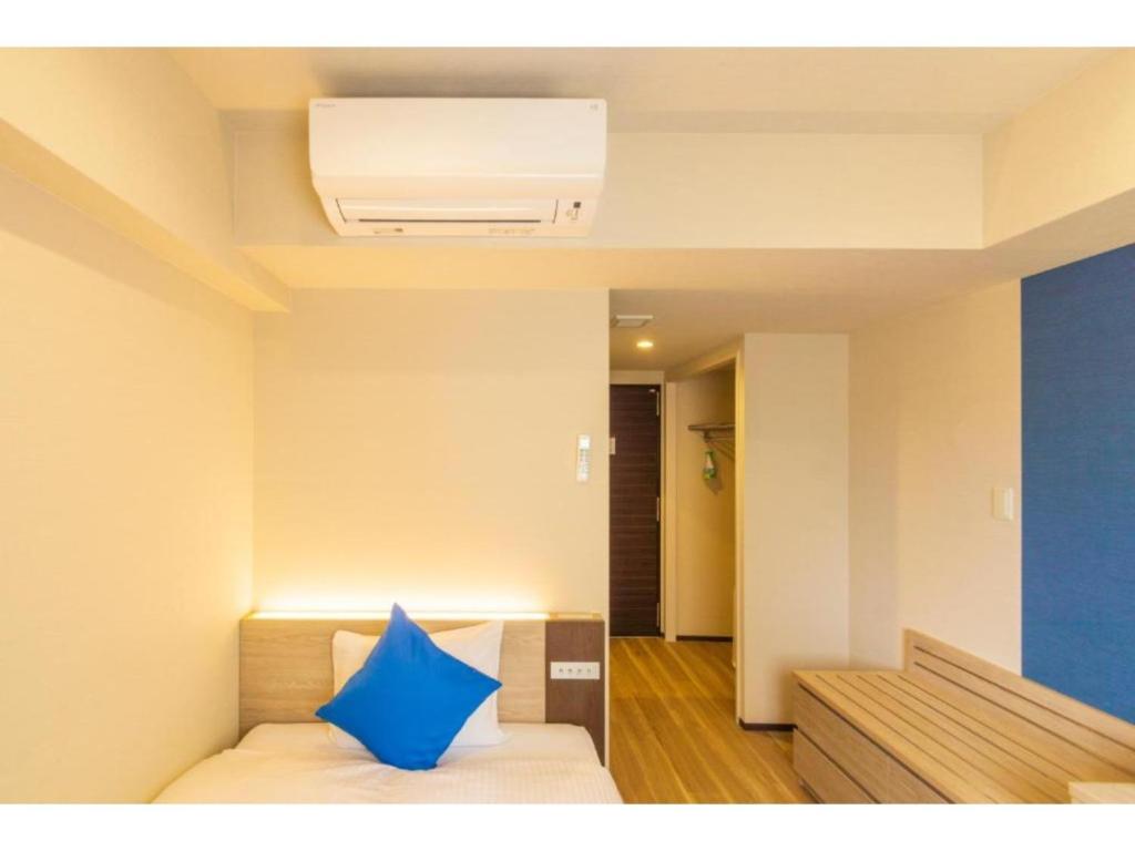 Ένα ή περισσότερα κρεβάτια σε δωμάτιο στο HOTEL LANTANA Naha Kokusai Street - Vacation STAY 65441v