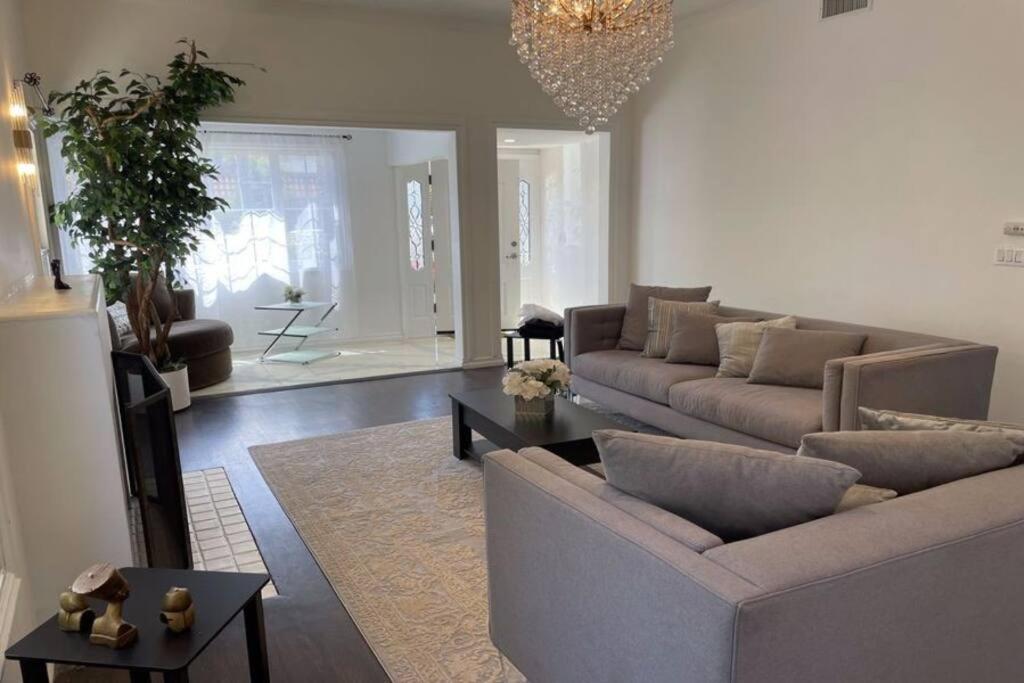 a living room with a couch and a table at 3 Bd Beverly Hills House in Los Angeles