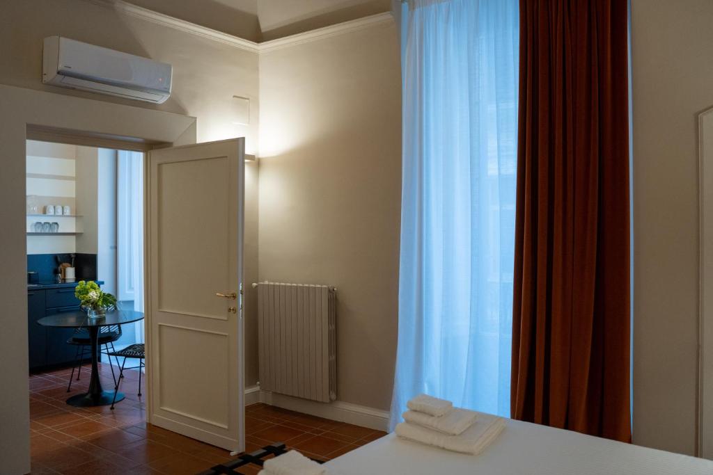 Postel nebo postele na pokoji v ubytování CASA ALMIKA PRINCIPE AMEDEO