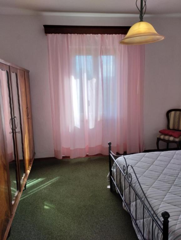 Posteľ alebo postele v izbe v ubytovaní Casa Graziella