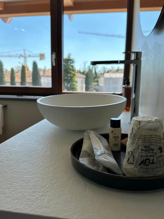 a bathroom counter with a sink on a counter top at C House Rooms Lake in Peschiera del Garda