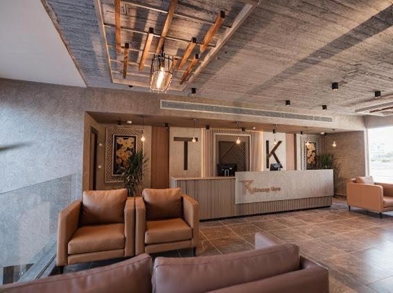 a lobby with a couch and chairs in a building at TK Suites in Hurghada
