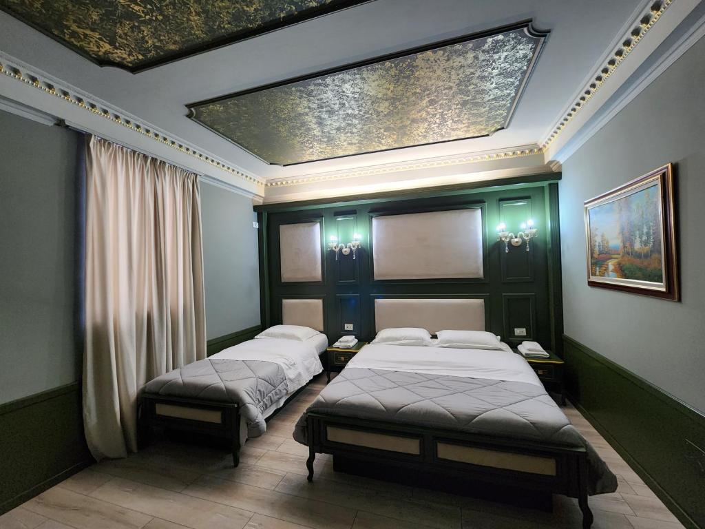 Postel nebo postele na pokoji v ubytování Hotel Lotus