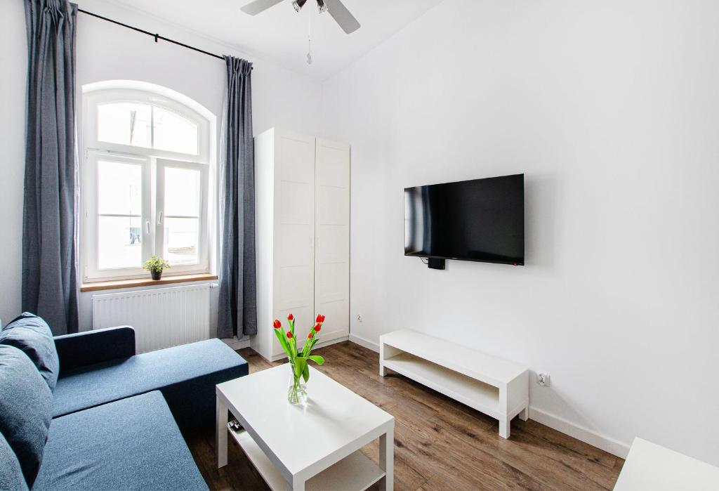 Televízia a/alebo spoločenská miestnosť v ubytovaní Smart Rental Management Apartments - CITY CENTER