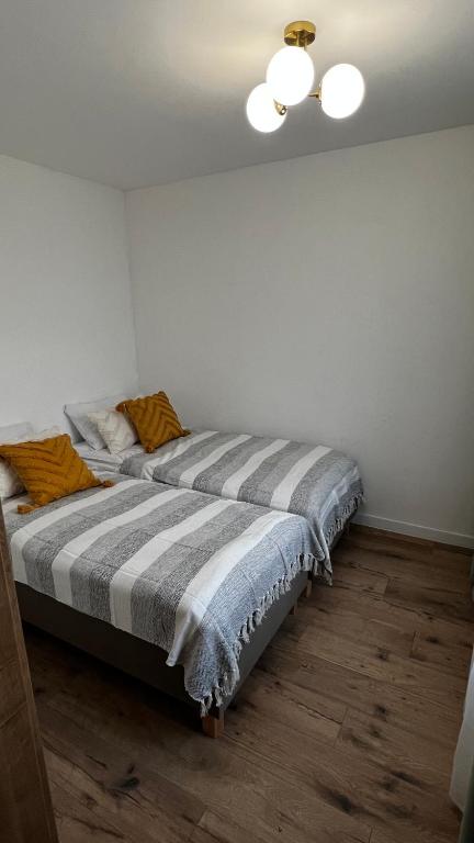 Posteľ alebo postele v izbe v ubytovaní Przystań Wilkasy