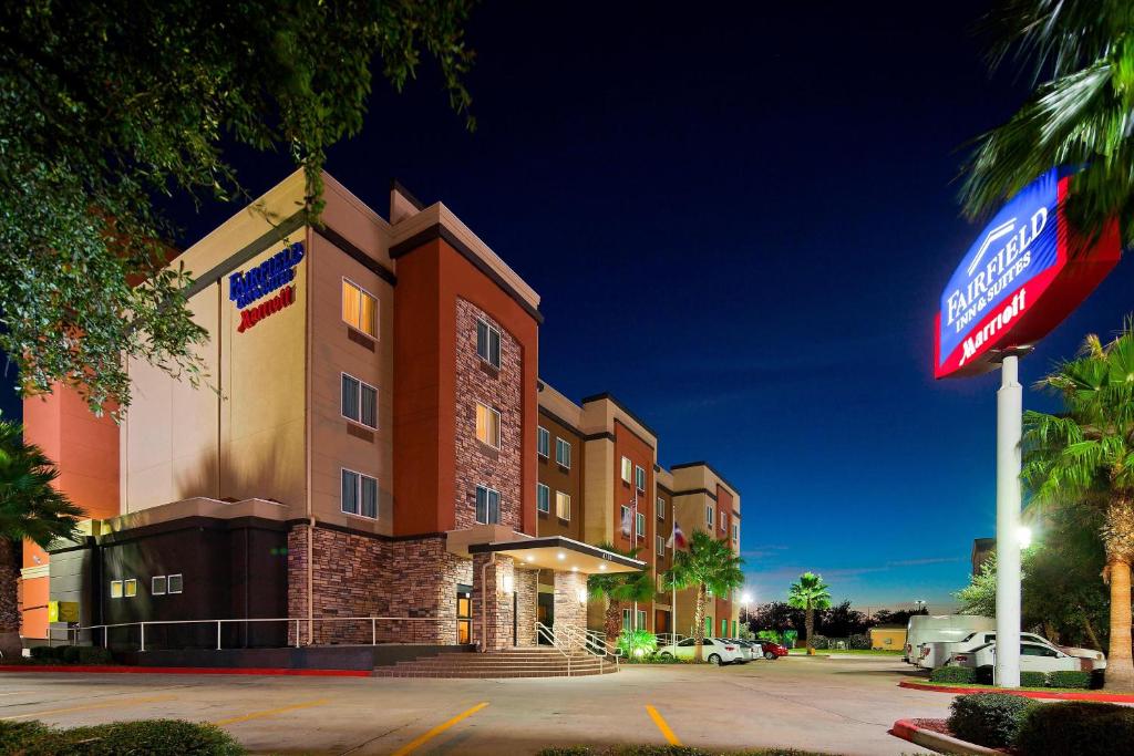 a hotel building with a sign in front of it at Fairfield Inn & Suites Houston Hobby Airport in Houston