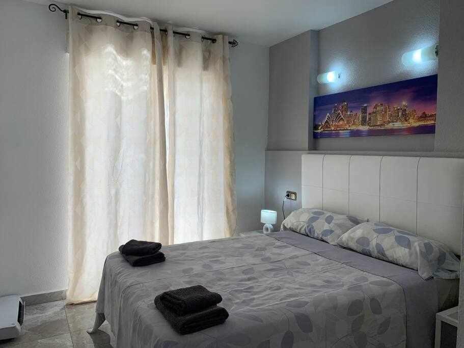 Posteľ alebo postele v izbe v ubytovaní Precioso apartamento a 200 metros del mar