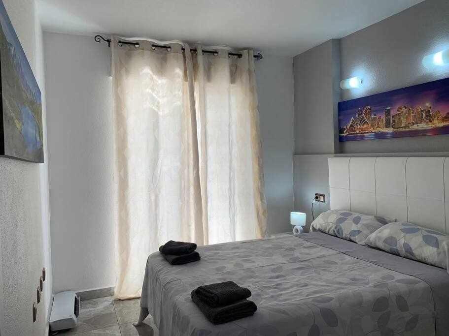 Posteľ alebo postele v izbe v ubytovaní Precioso apartamento a 200 metros del mar