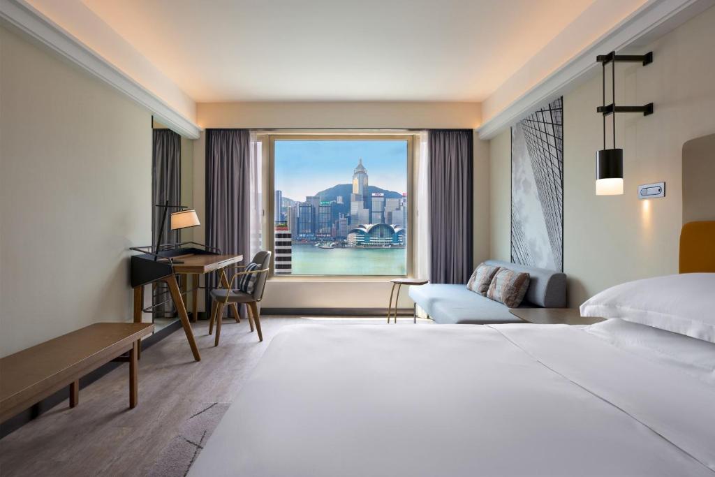 Postel nebo postele na pokoji v ubytování Sheraton Hong Kong Hotel & Towers