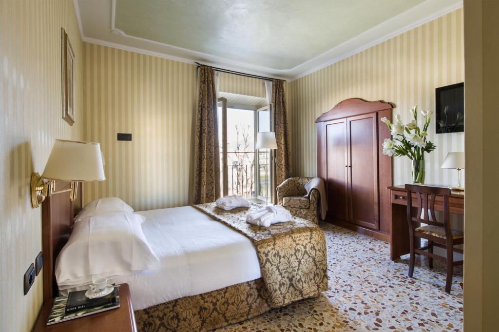 Postel nebo postele na pokoji v ubytování Hotel Silla
