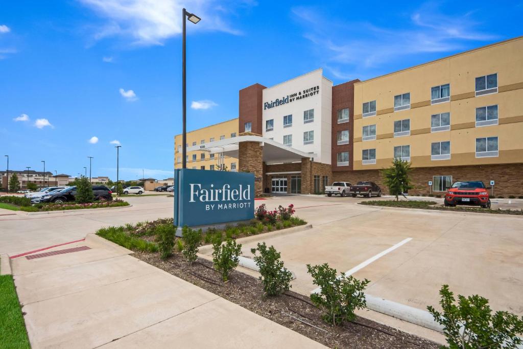 a rendering of a hotel with a sign in a parking lot at Fairfield Inn & Suites by Marriott Dallas Plano/Frisco in Plano