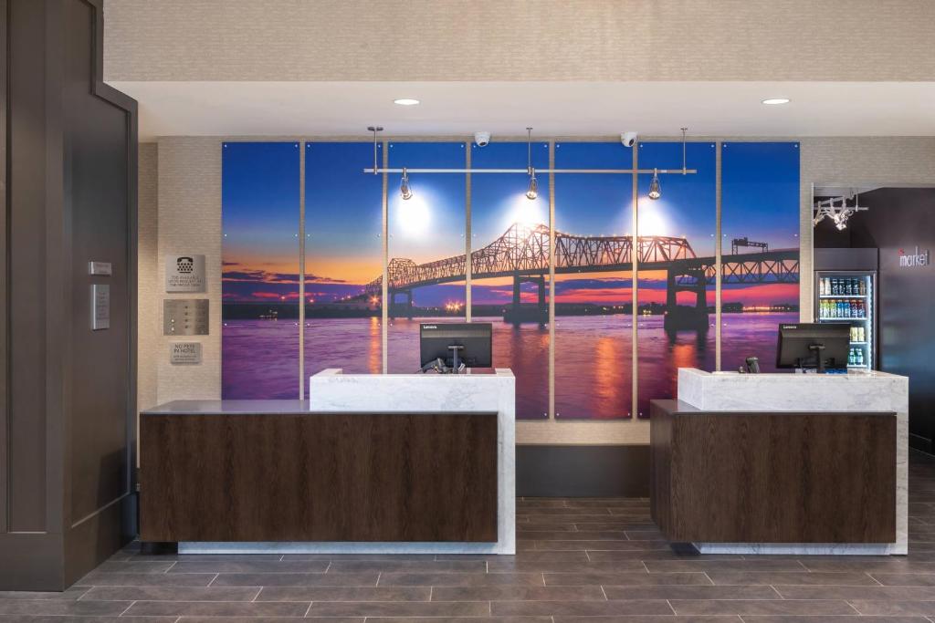 a lobby with a view of a bridge mural at Courtyard by Marriott Baton Rouge Downtown in Baton Rouge
