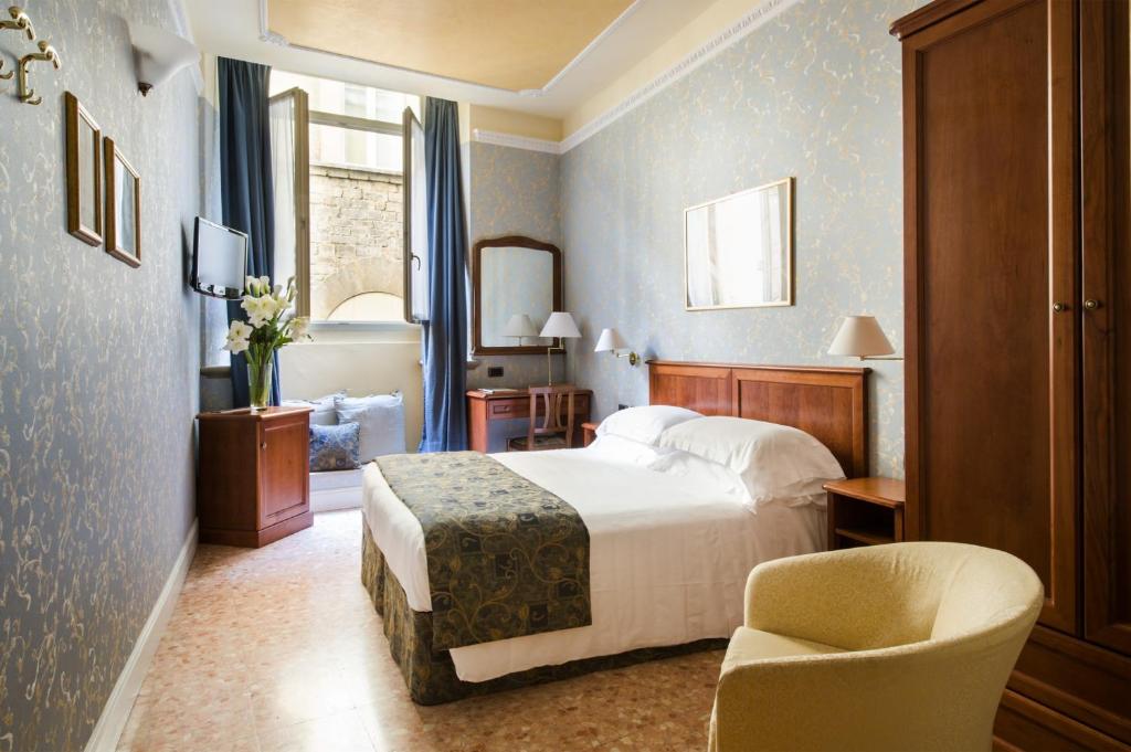 Postel nebo postele na pokoji v ubytování Hotel Silla