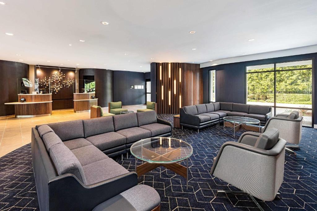 a living room with couches and chairs and a table at Courtyard by Marriott Anaheim Resort/Convention Center in Anaheim