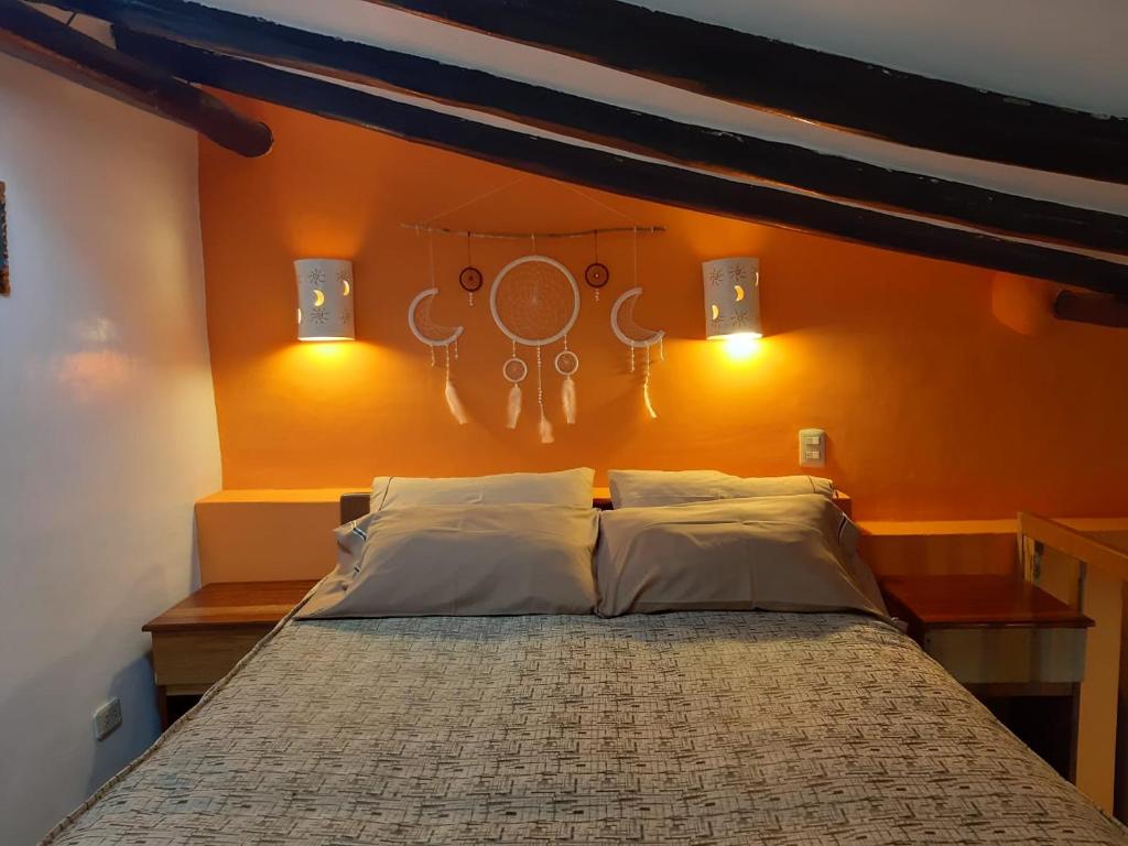 Кровать или кровати в номере Hatun Quilla