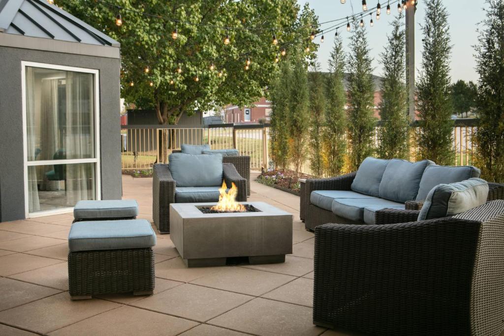 a patio with couches and a fire pit at Fairfield Inn & Suites by Marriott Tulsa Central in Tulsa