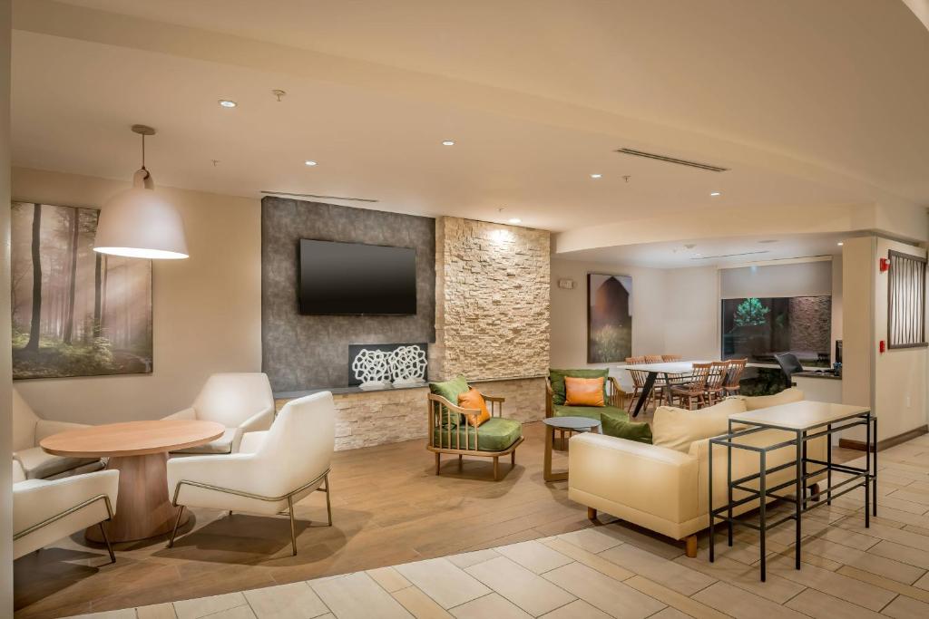 a lobby with a living room and a dining room at Fairfield Inn & Suites by Marriott New Braunfels in New Braunfels
