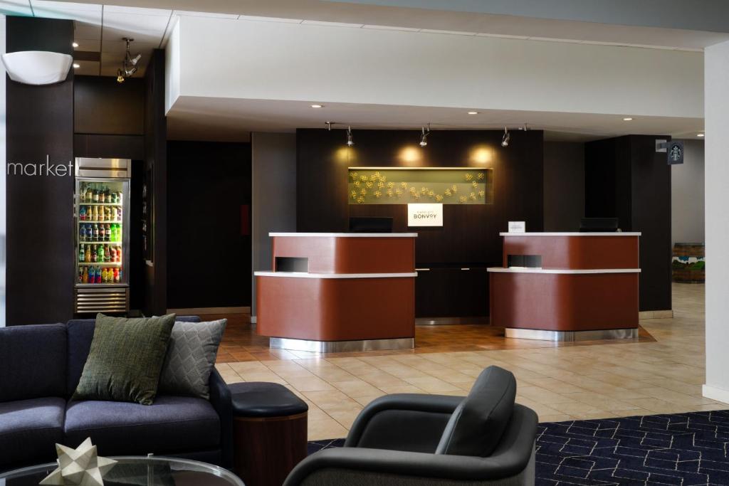 a lobby of a hotel with a barber shop at Courtyard by Marriott Santa Rosa in Santa Rosa