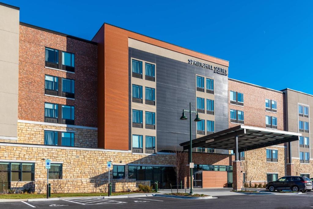 a rendering of a building with a parking lot at SpringHill Suites by Marriott Overland Park Leawood in Overland Park
