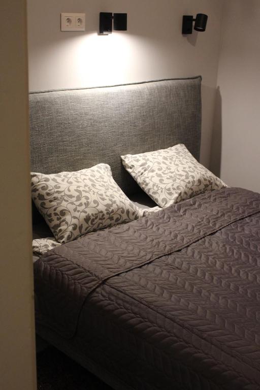 Posteľ alebo postele v izbe v ubytovaní GreyBlack Styles Apartment