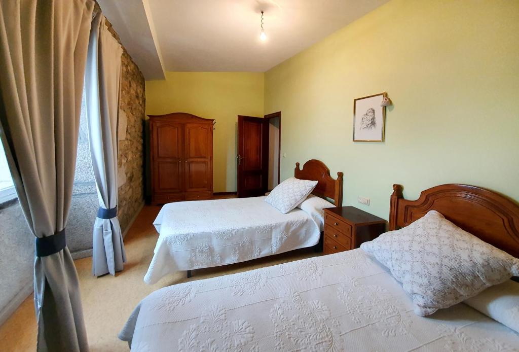 Cama o camas de una habitación en La Casa de Ana en Fisterra