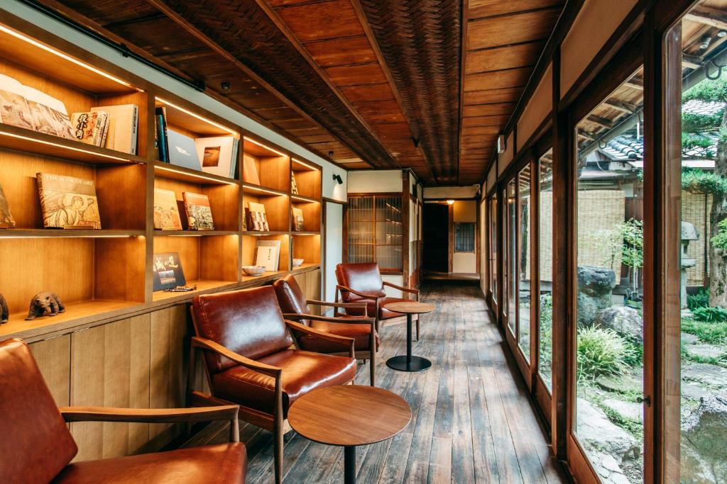 a waiting room with chairs and tables and a window at RITA Gosemachi in Gose