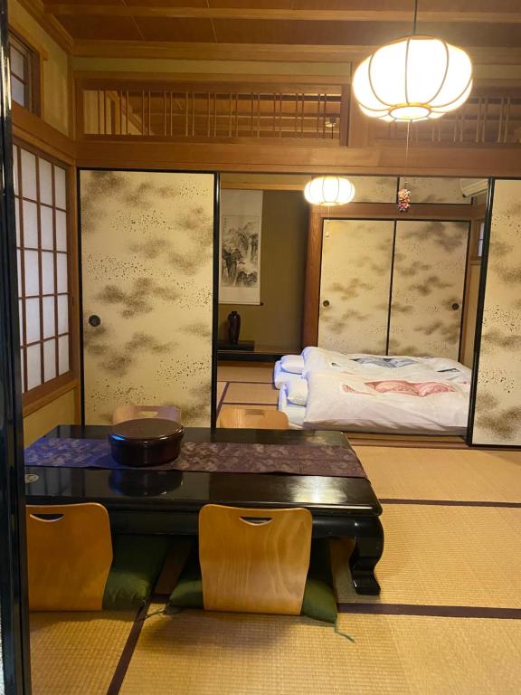Postel nebo postele na pokoji v ubytování 宮城野ハウス＆離れ